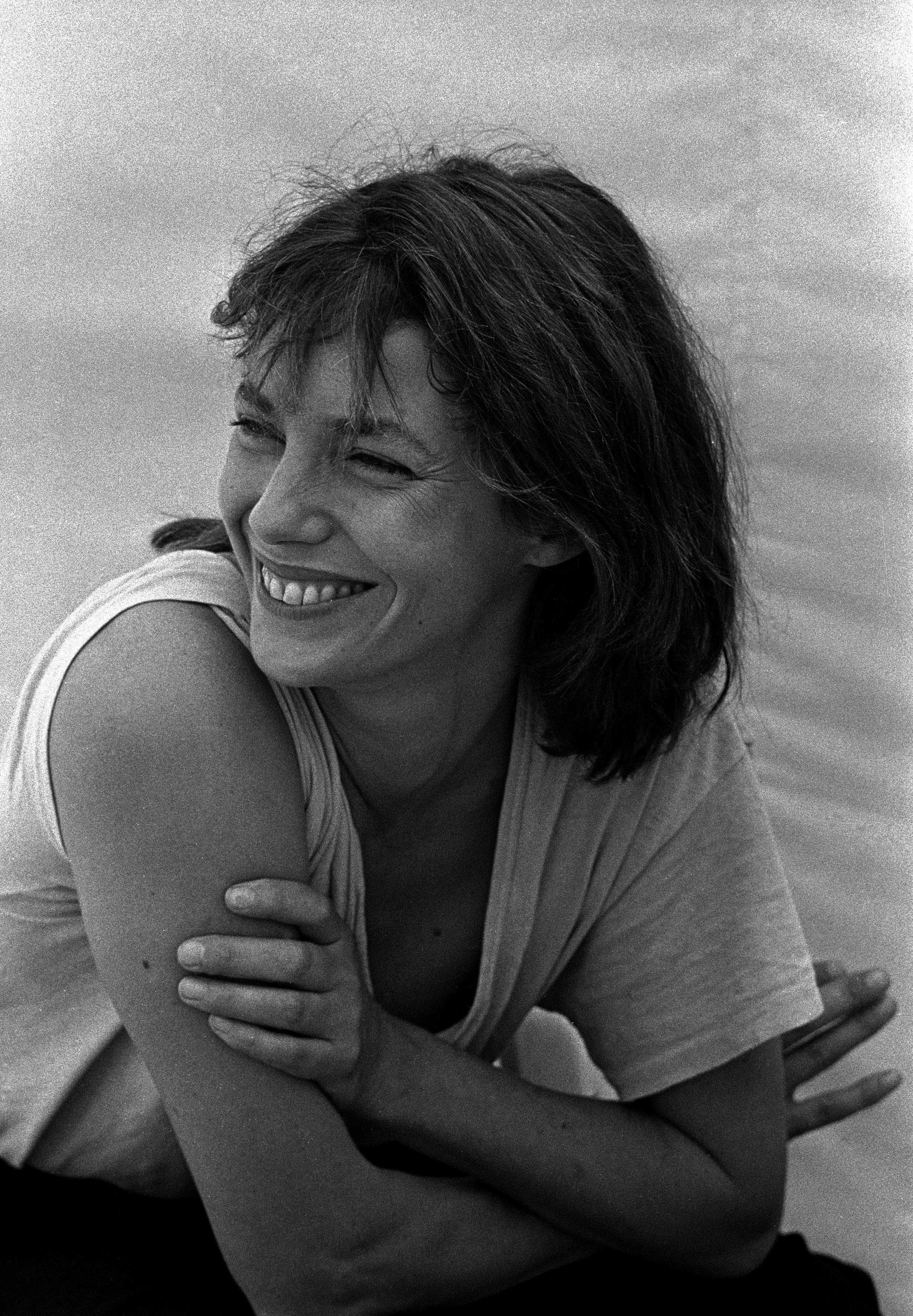 English actress Jane Birkin portrayed in Venice for the Movie Festival, 1984 : Smiling