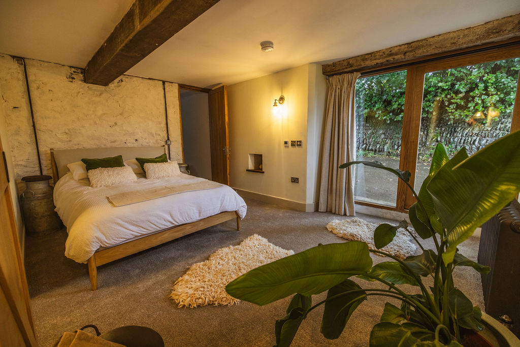 Inside The Dairy barn suite at Borough Farm, Devon