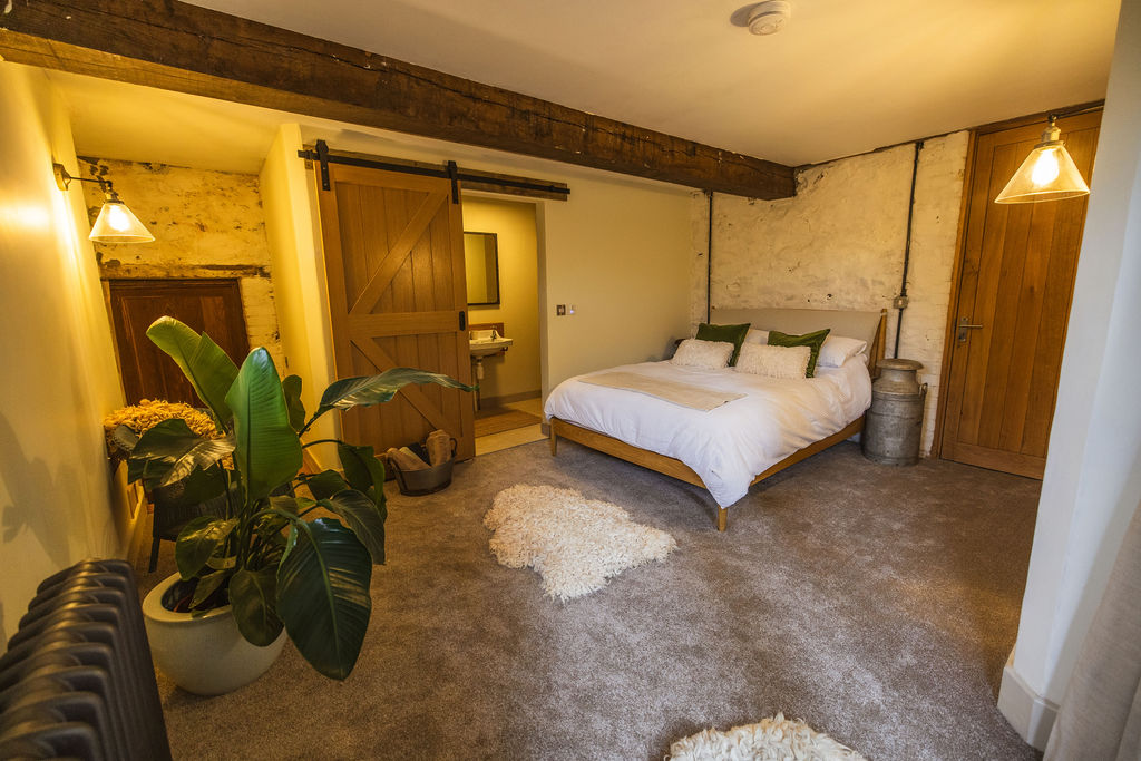 The Dairy — accessible ground-floor barn suite with king bed at Borough Farm, Devon