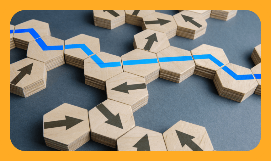 Wooden blocks with random arrows and others with a single unbroken line to illustrate the topic of ad-hoc and targeted surveys