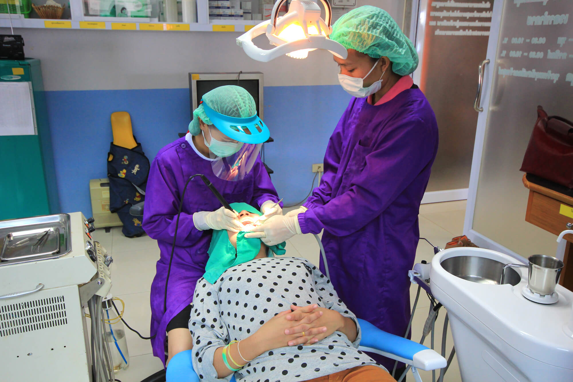 dentists performing Sedation Dentistry Pompano Beach on patient
