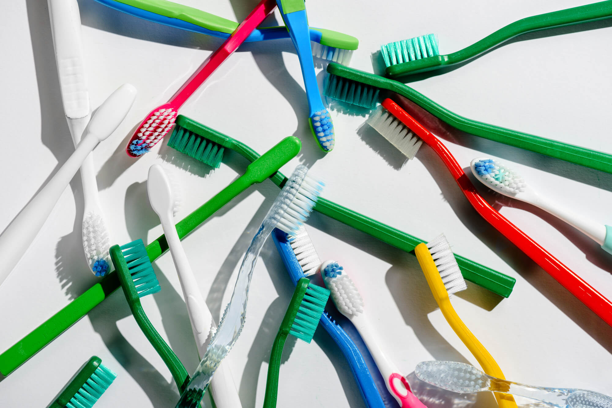 different kinds of toothbrushes in various colors