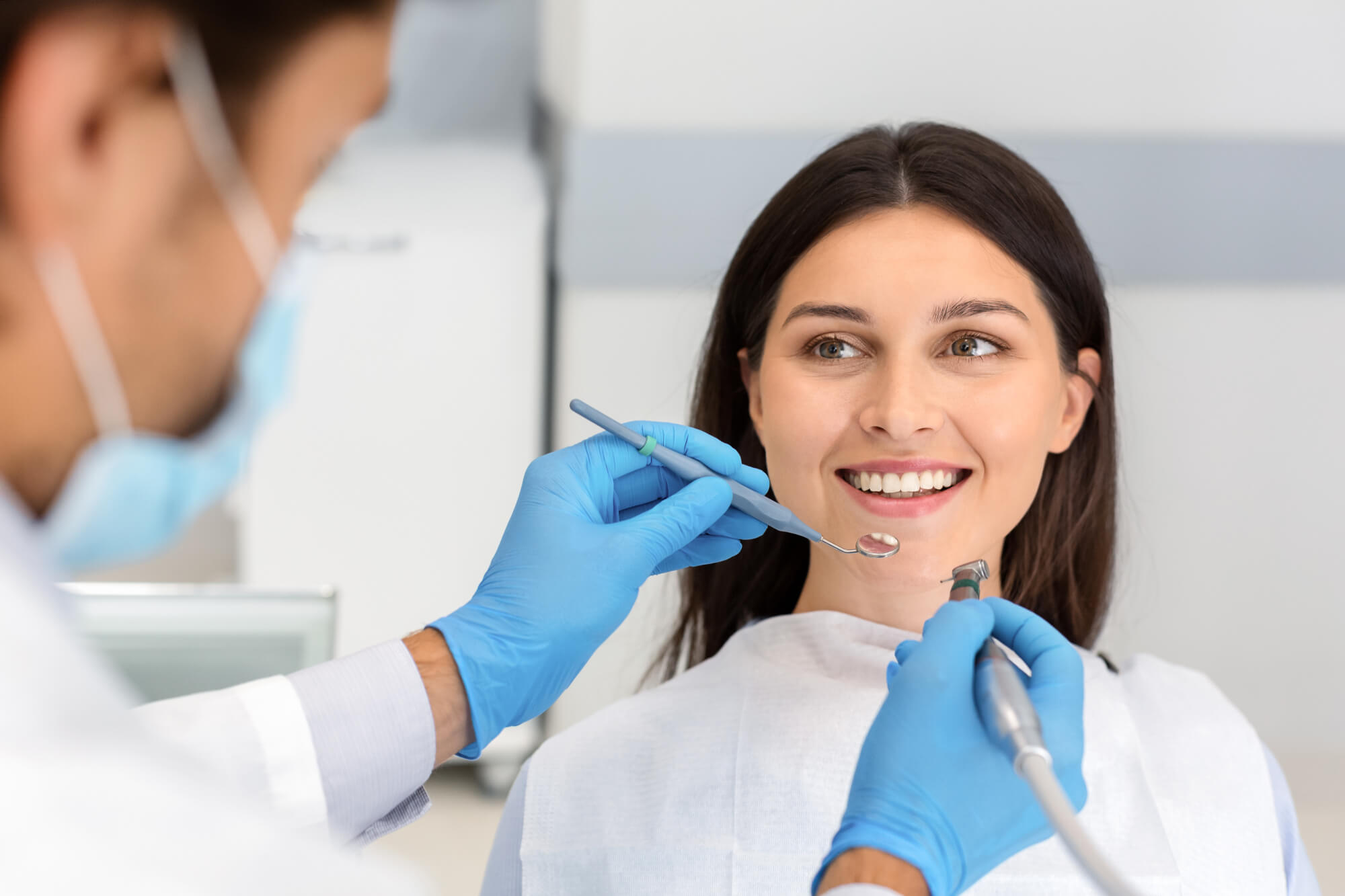 Prosthodontist Pompano Beach giving dental tips to dental client
