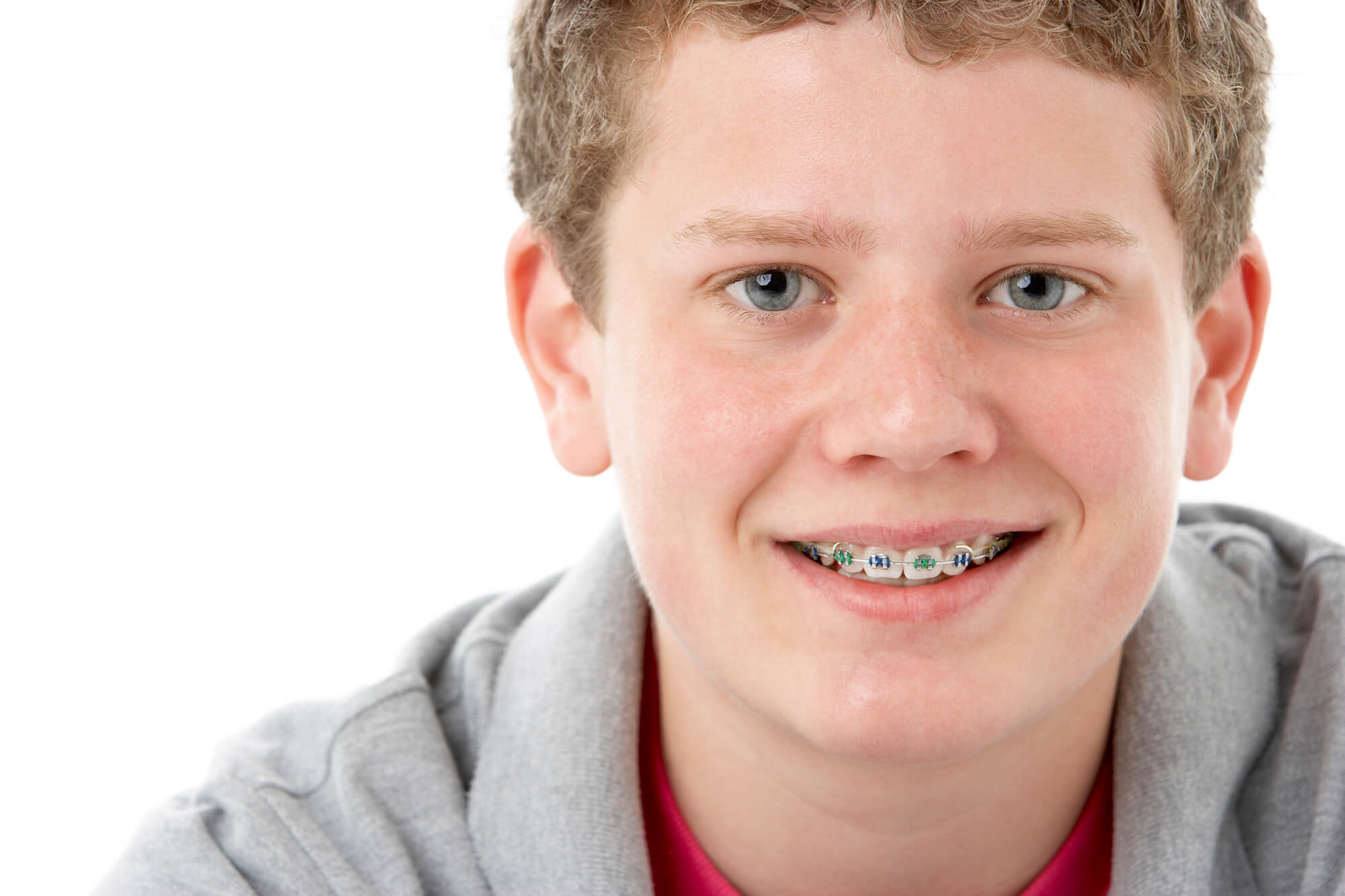 boy wearing braces installed by his orthodontist 33062