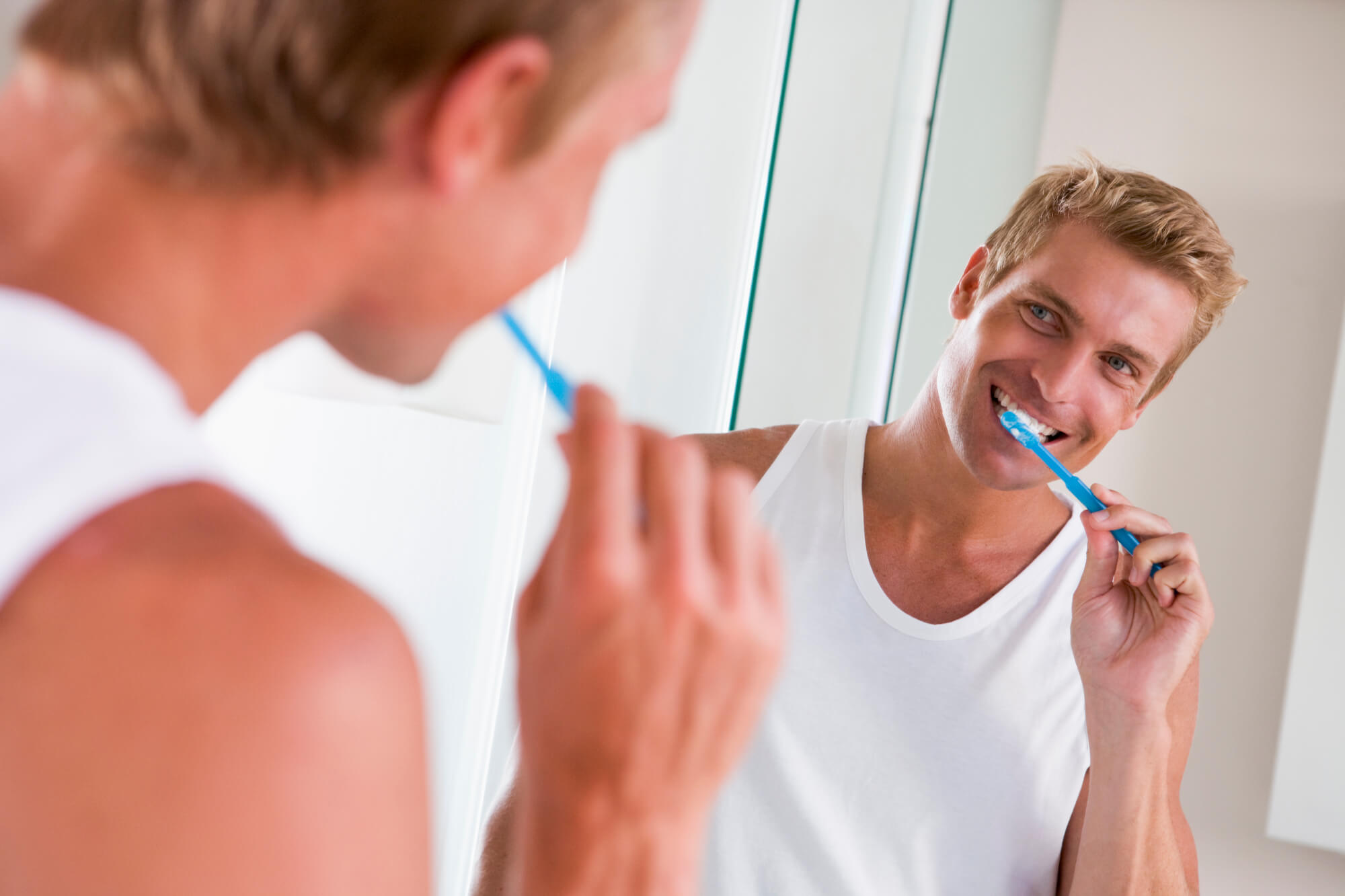 man brushing his teeth after following Dentist 33062 suggestions