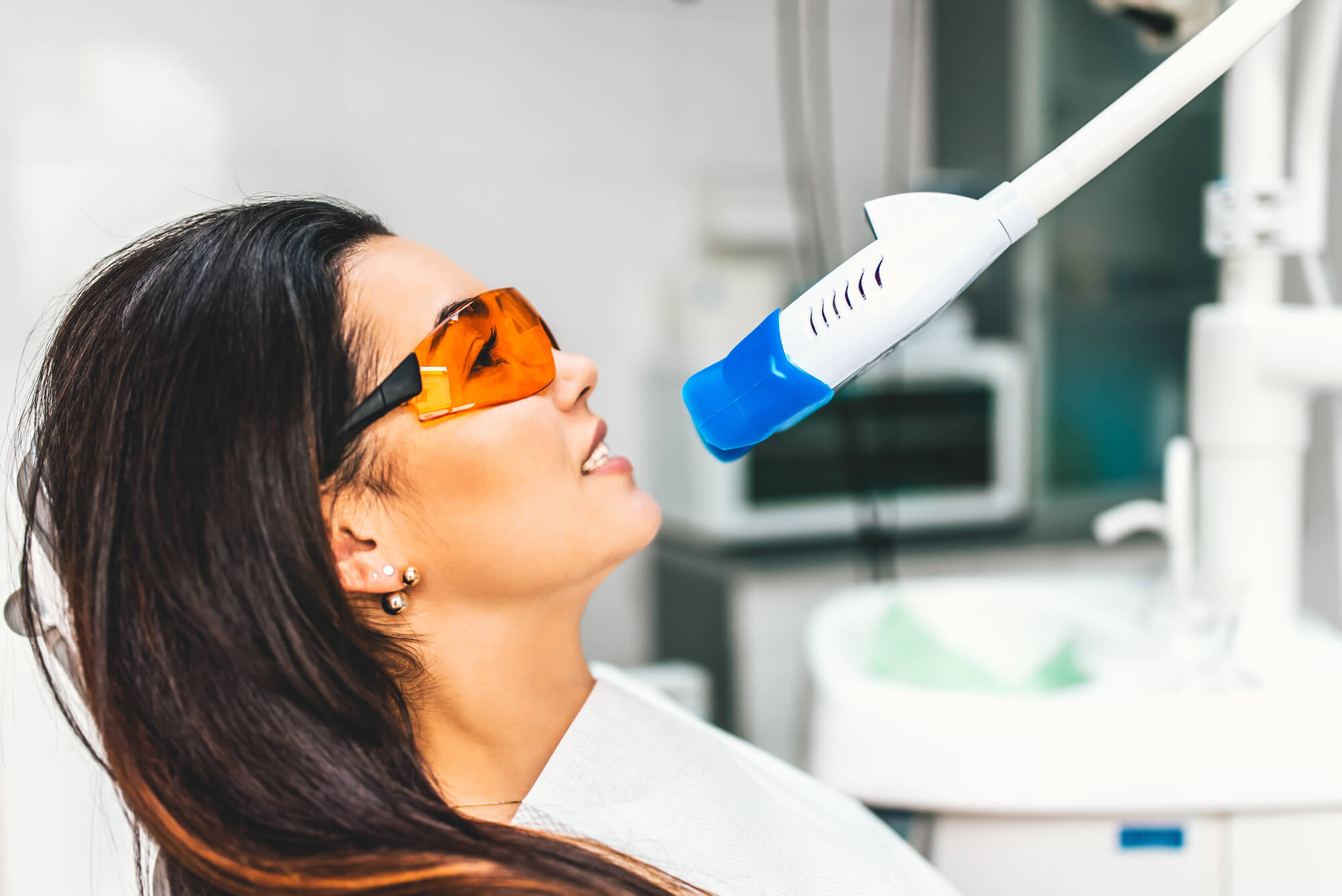 brunette patient getting Teeth Whitening in Pompano Beach