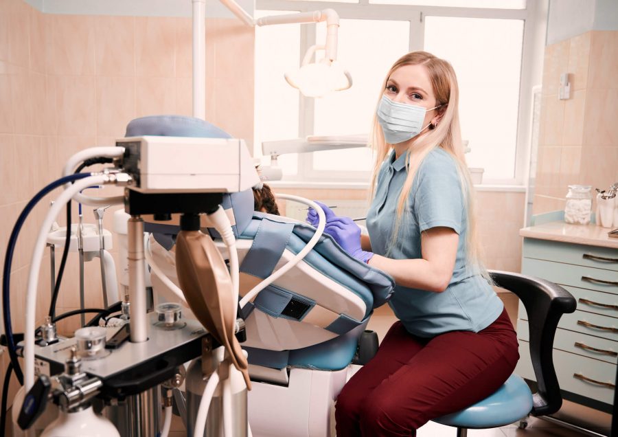 dentist preparing to give Dental Implants in 33062