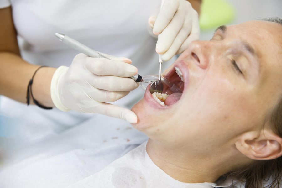 Dentist in Pompano Beach checking patient
