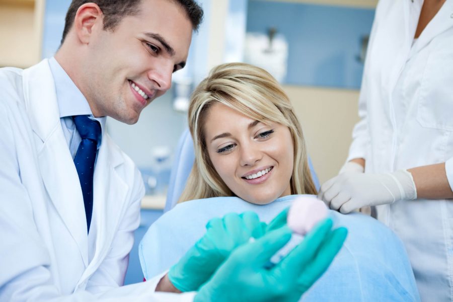 Prosthodontist in Pompano Beach attending a patient