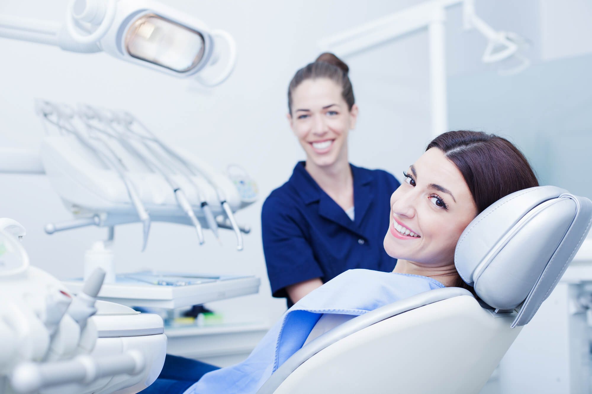Smiling woman and dentist in an office in Pompano Beach