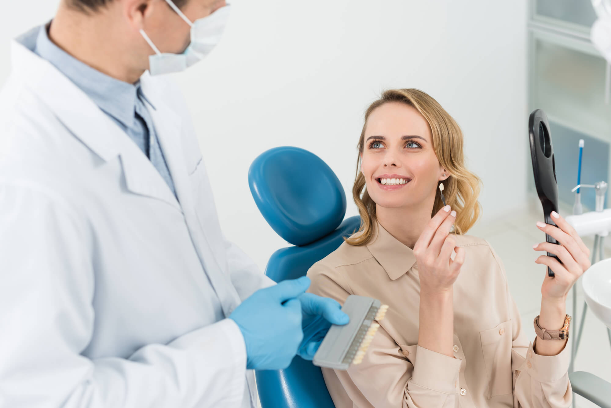 woman smiling to her dentist after getting dental implants in 33062