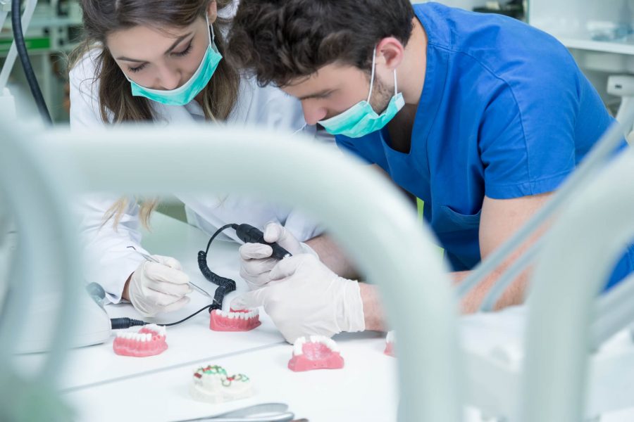 Dentist fixing Dentures in Pompano Beach