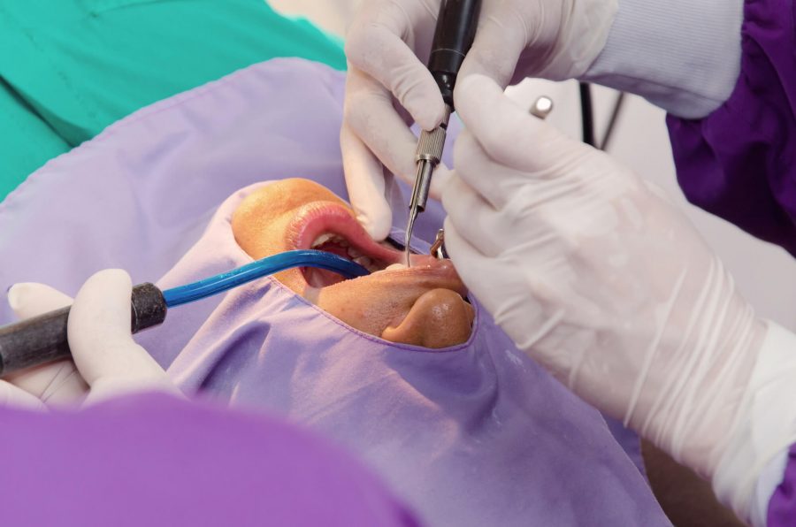 Dentist in Pompano Beach operating on patinet