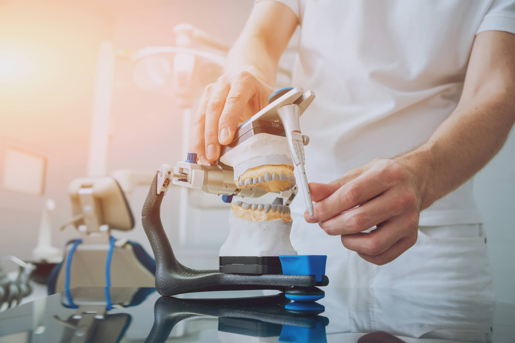 A prosthodontist in Pompano Beach making tooth replacements