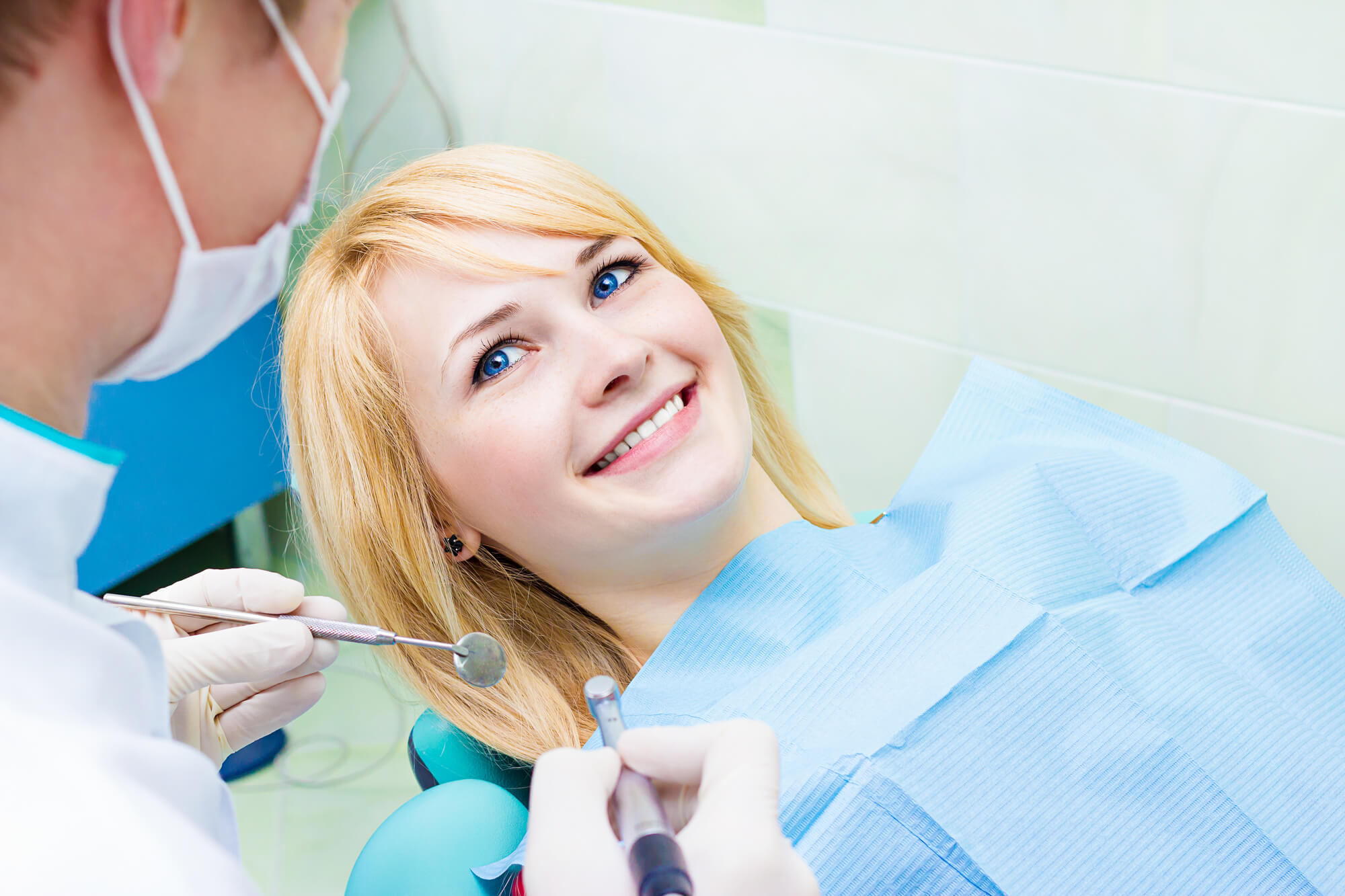 Smiling patient with cosmetic dentist in Pompano Beach