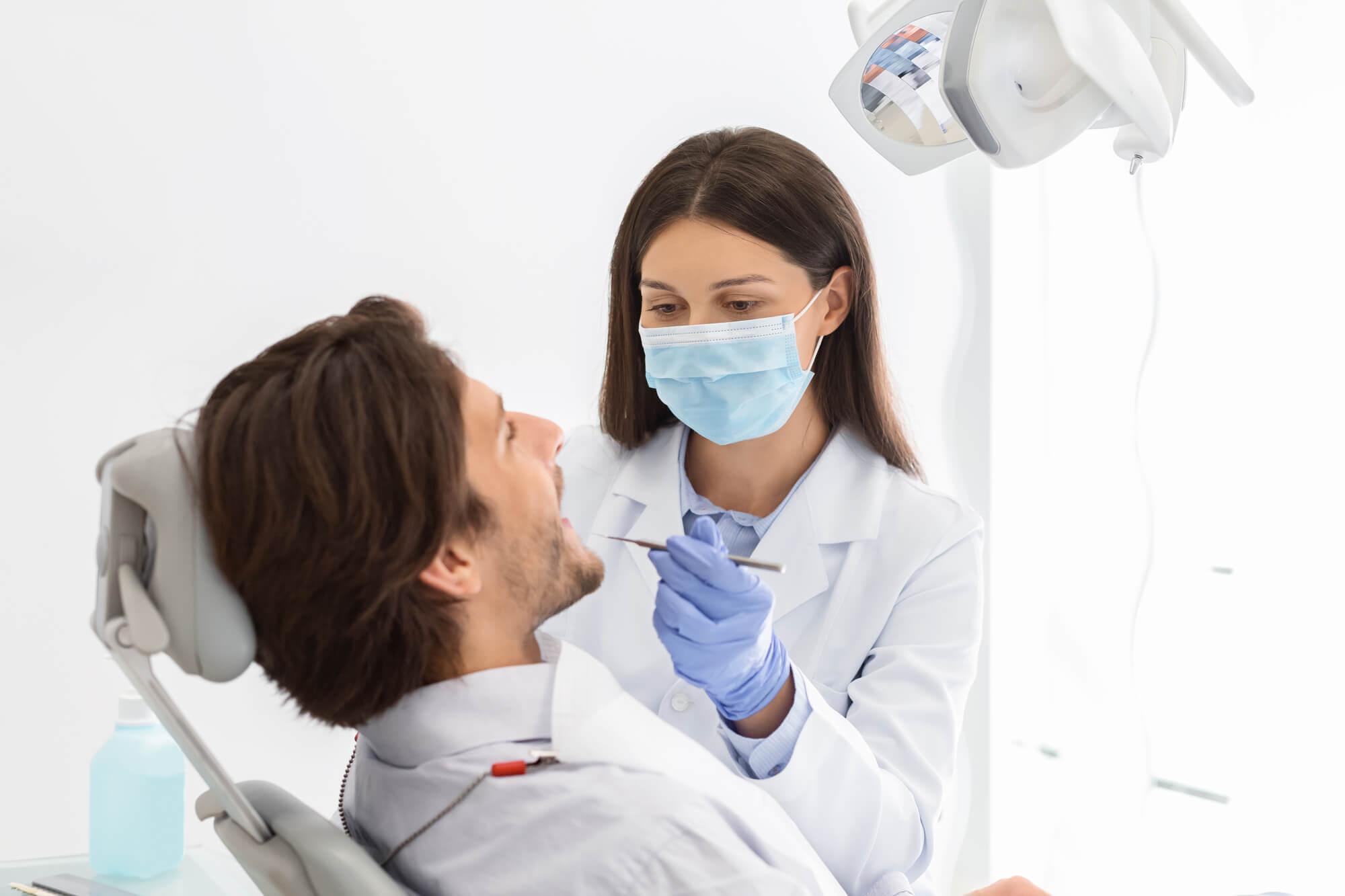 A Dentist in Pompano Beach treating a patient