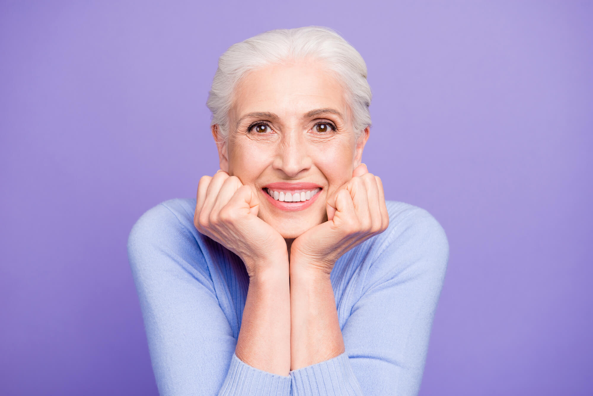 Older lady with dental Implants in 33062 smiling