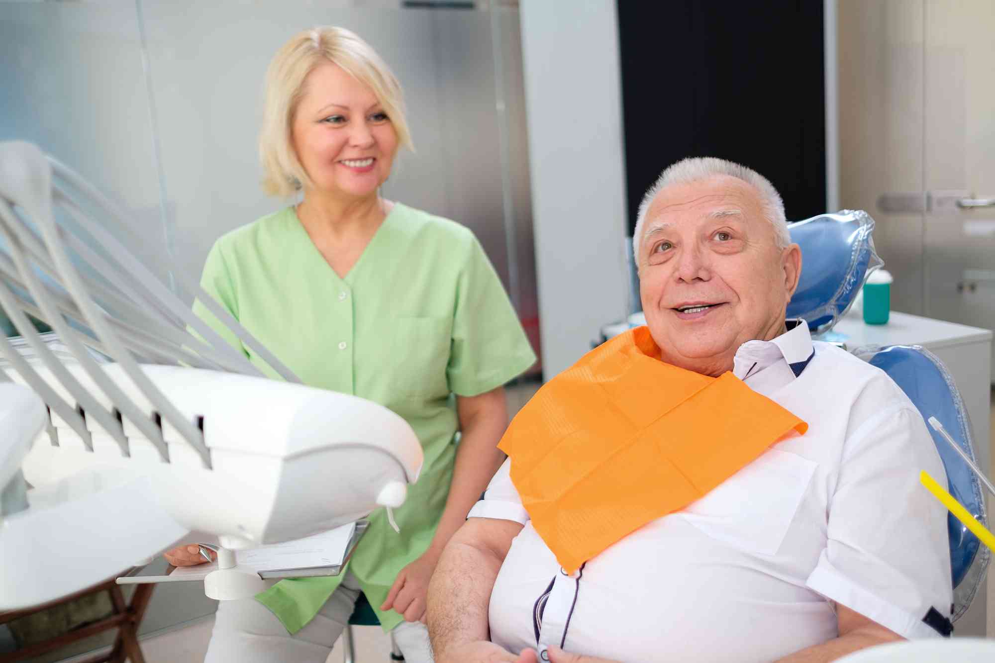 elderly man next to a prosthodontist in Pompano Beach