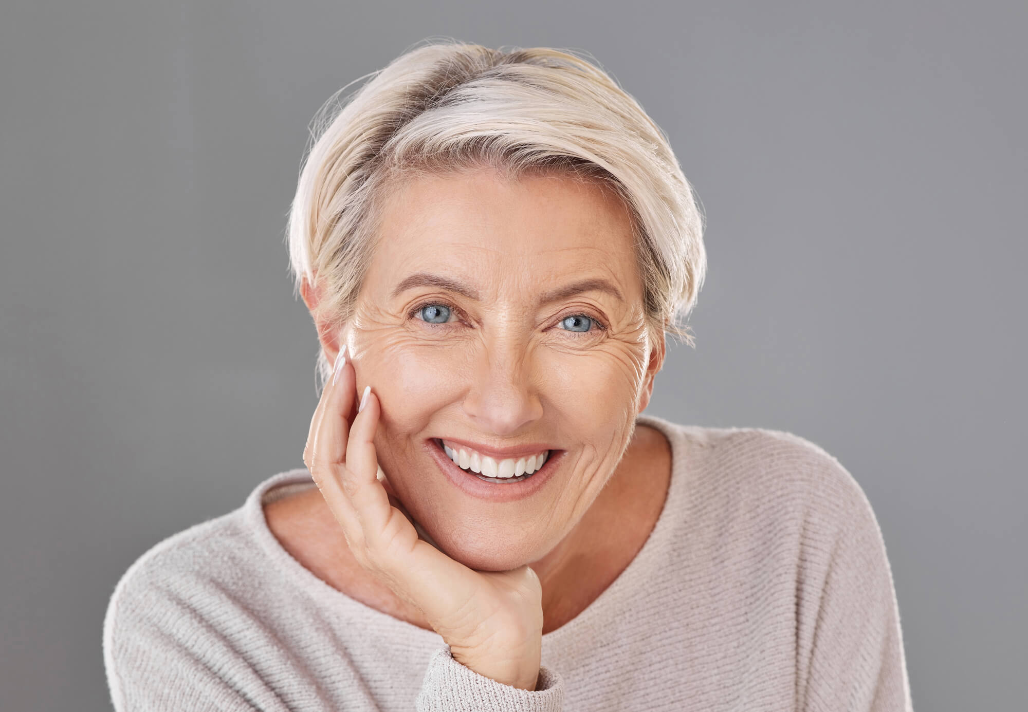 A Woman happy with dentures in Pompano Beach.
