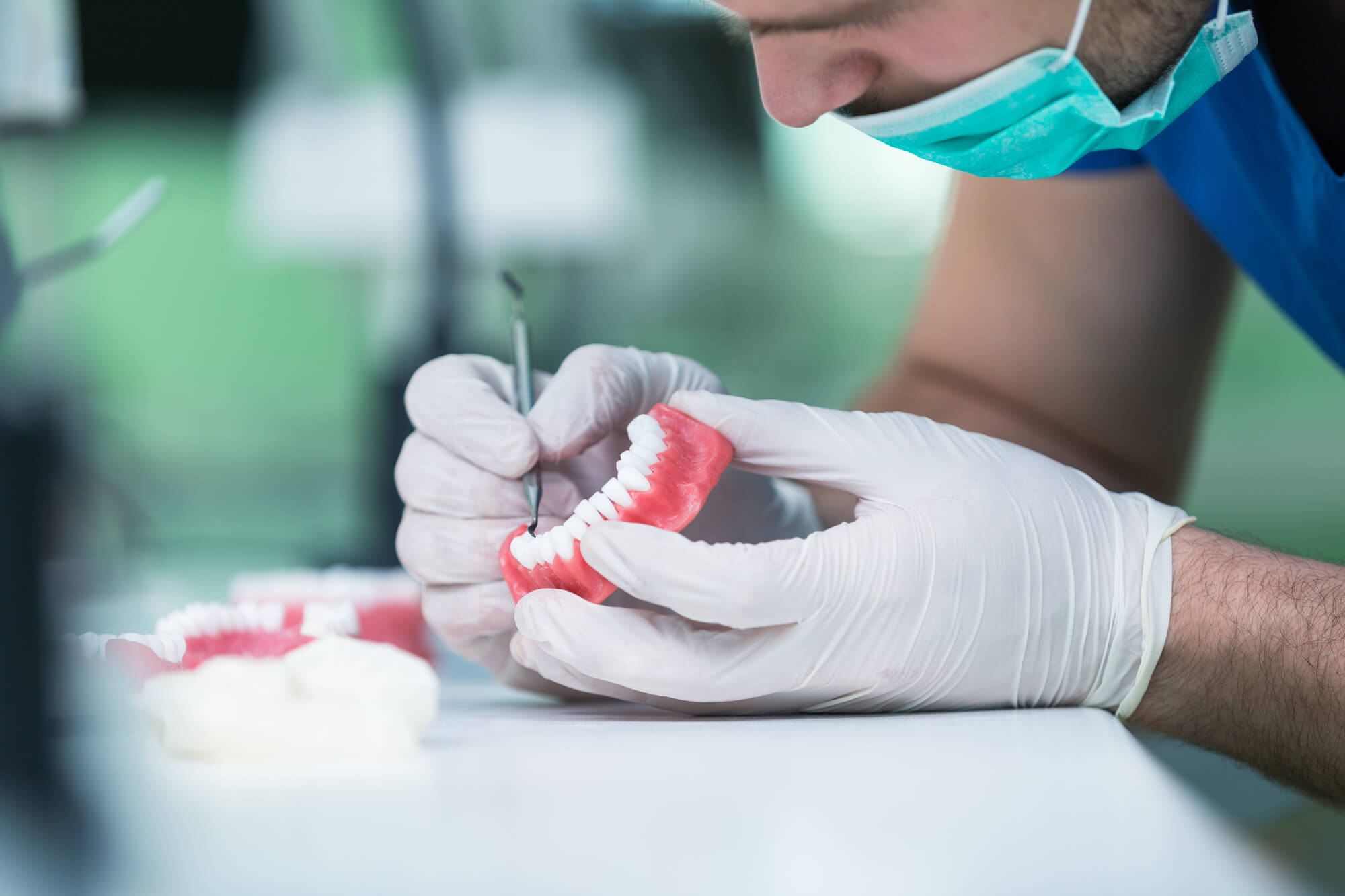 prosthodontist adjusting Dentures Pompano Beach