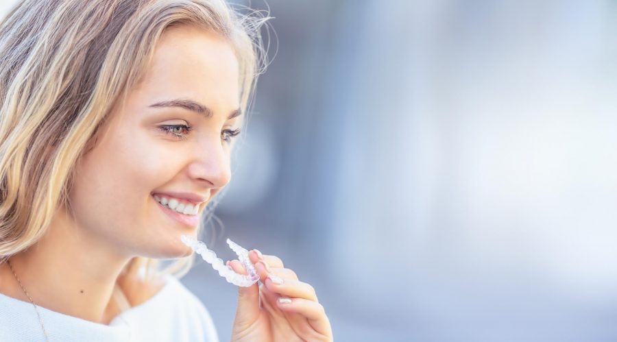 woman with Invisalign® in Pompano Beach