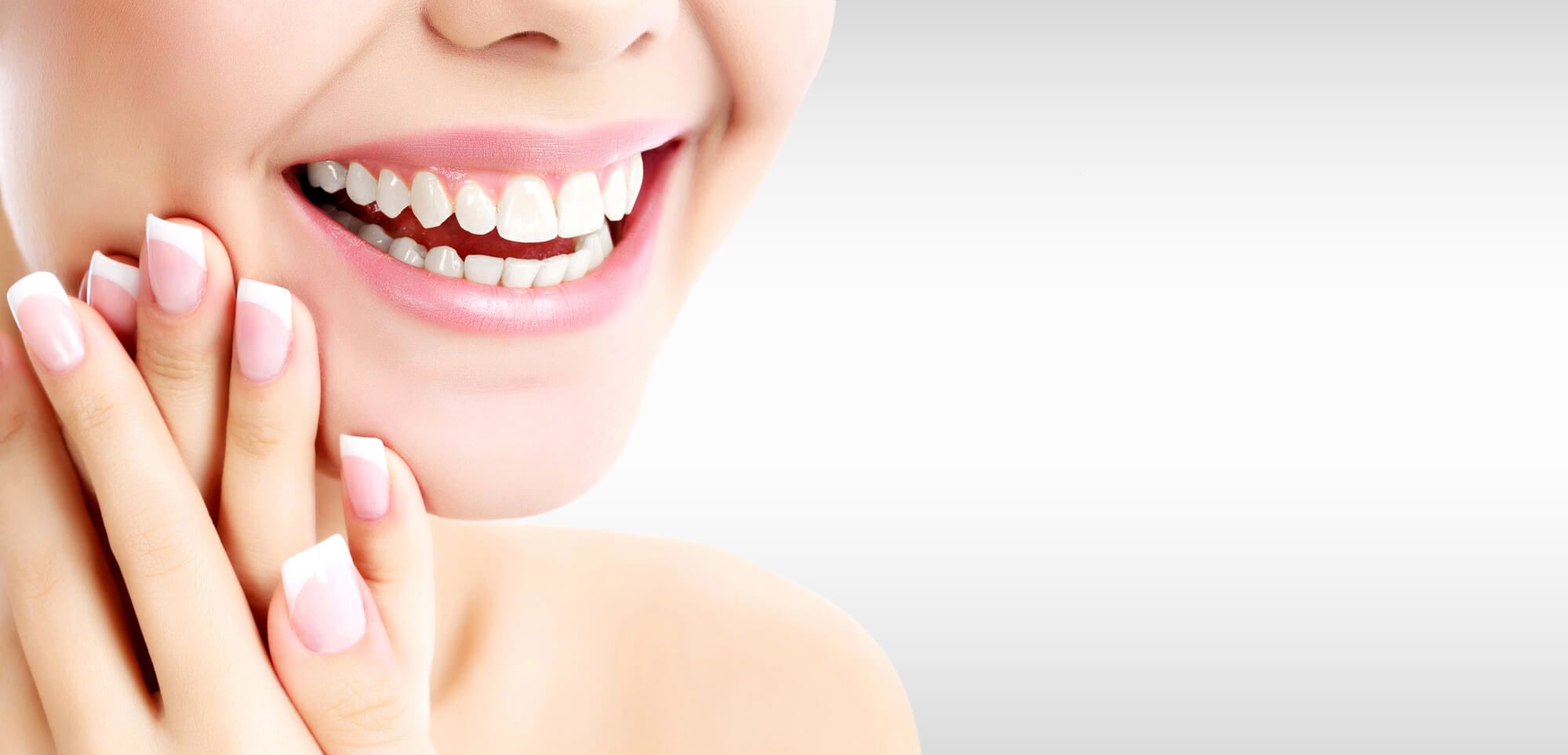 woman smiling after visiting her cosmetic dentist Pompano Beach