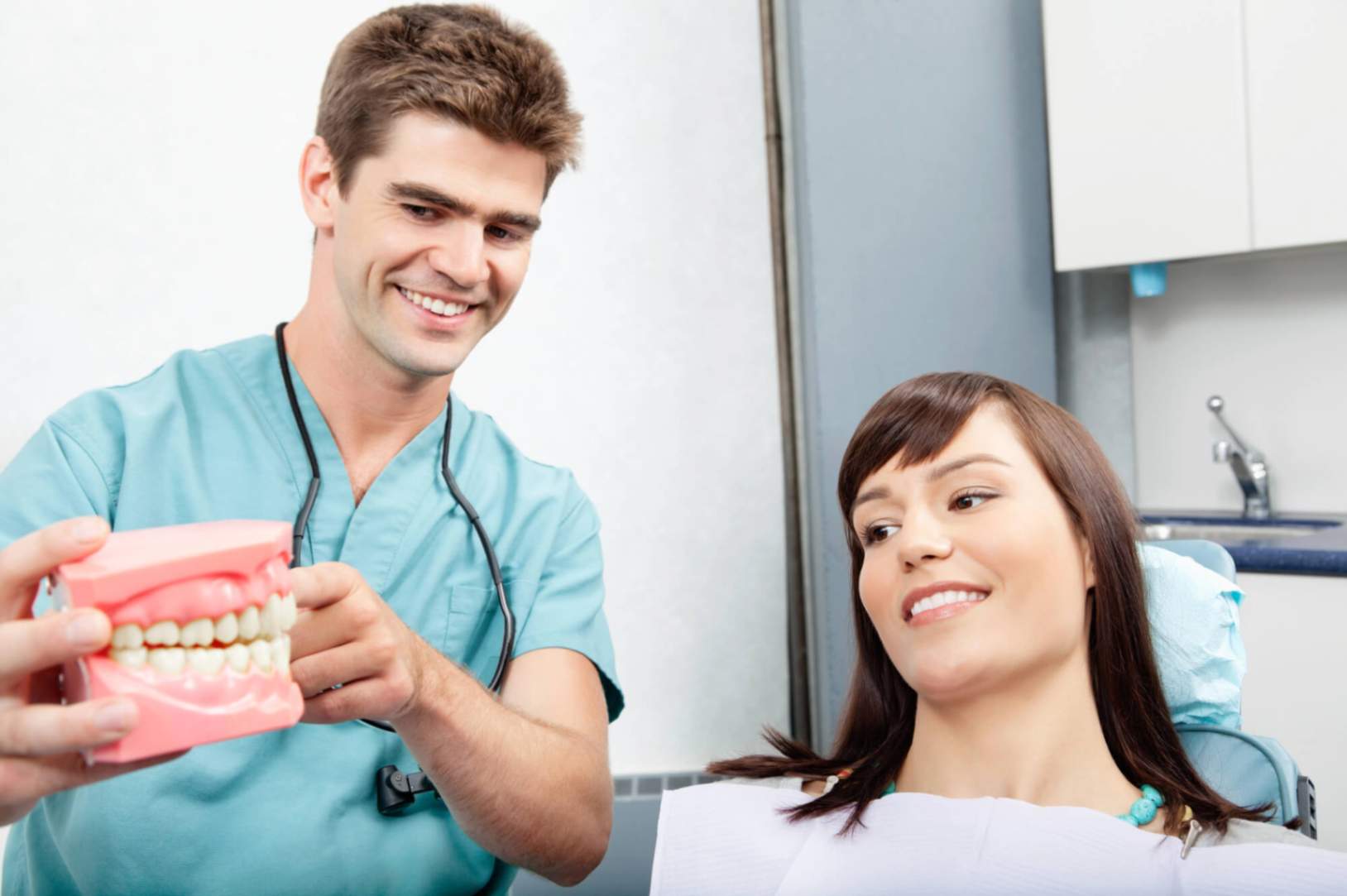 Cosmetic Dentist Pompano Beach explaining to patient