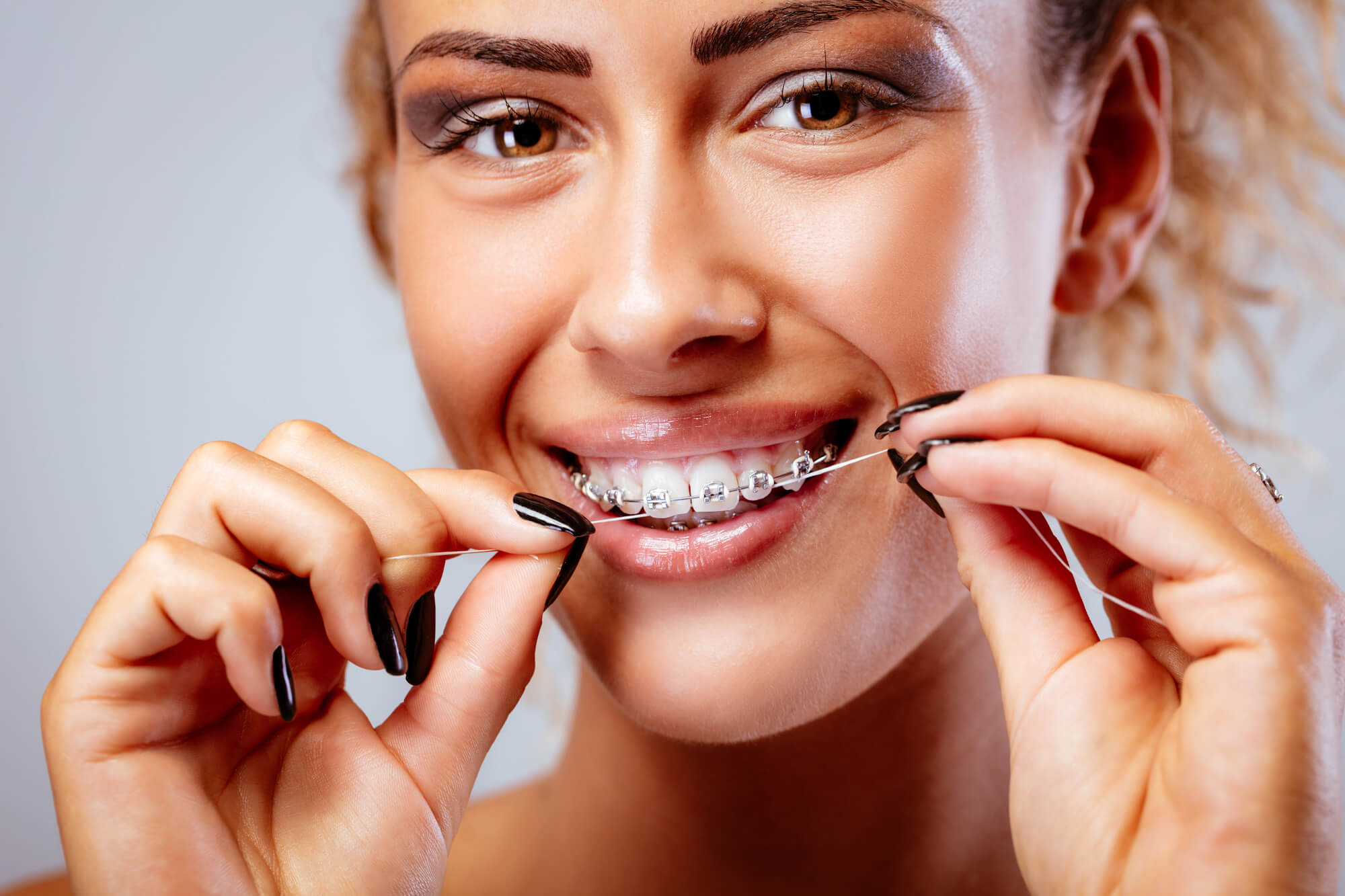 Girl Keeping Their Braces in Pompano Beach Clean