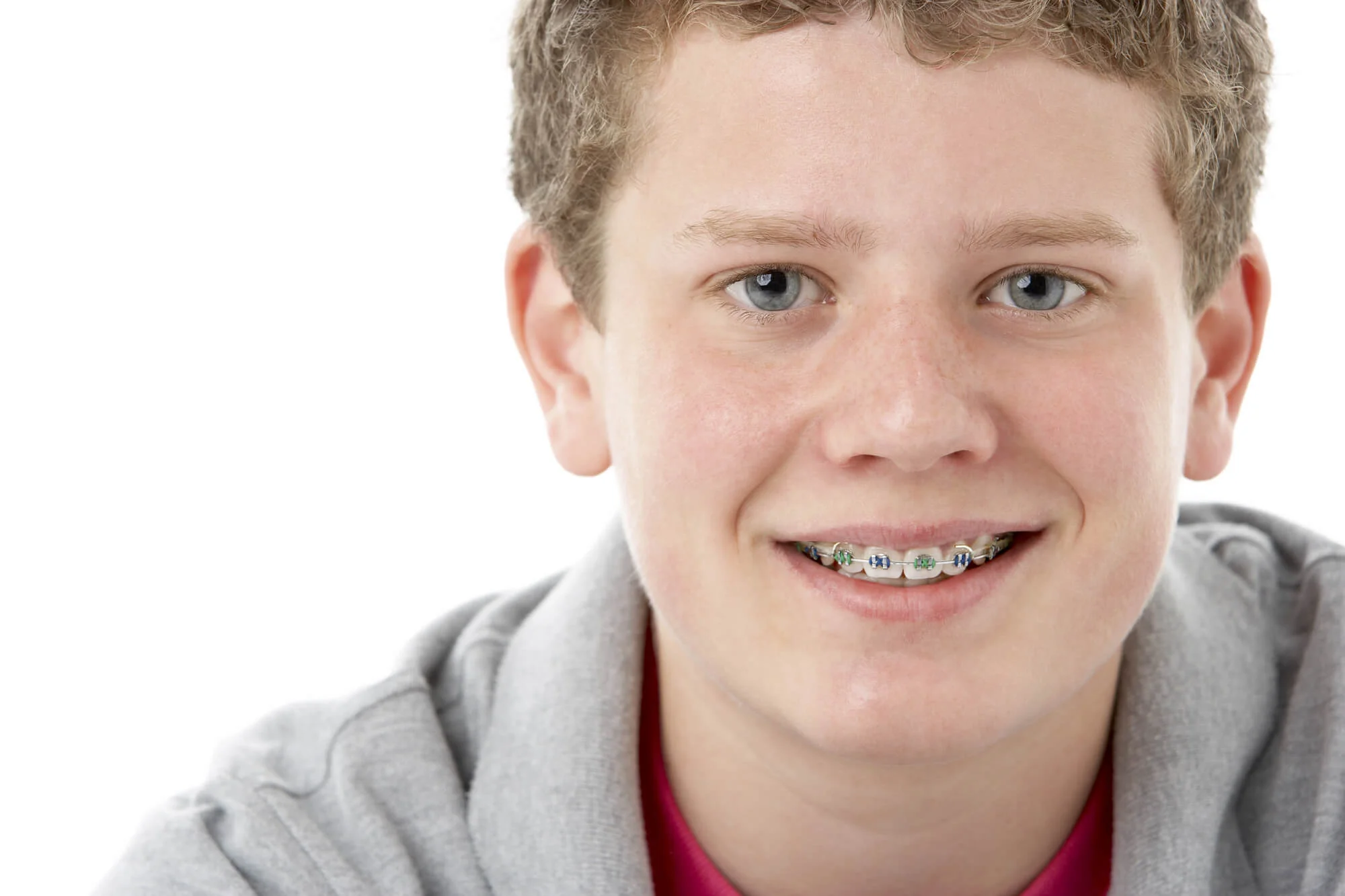Smiling child wearing braces in Pompano Beach.