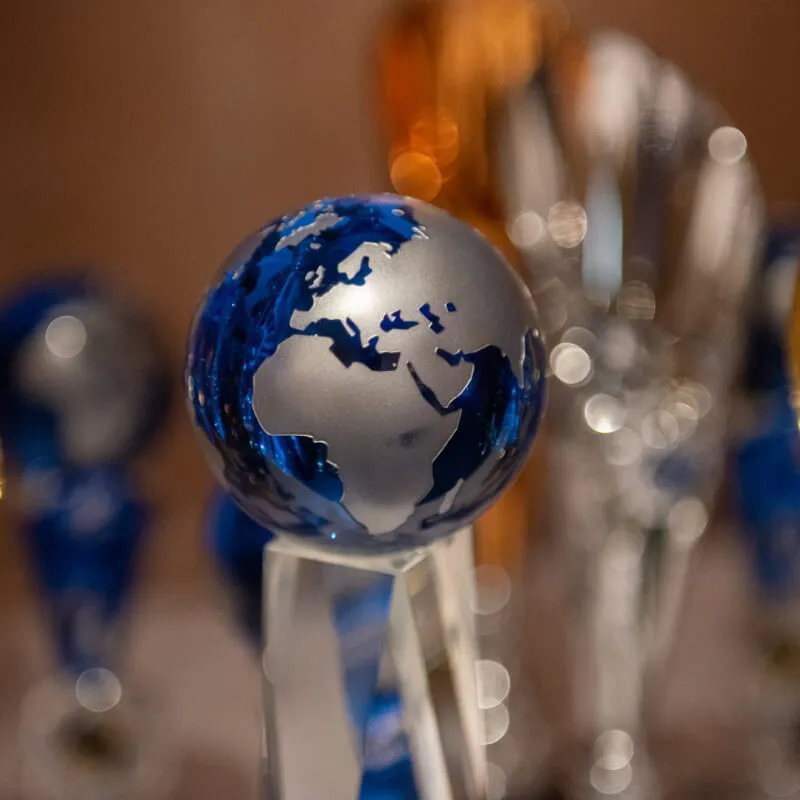 Close up of a blue trophy against blurred background