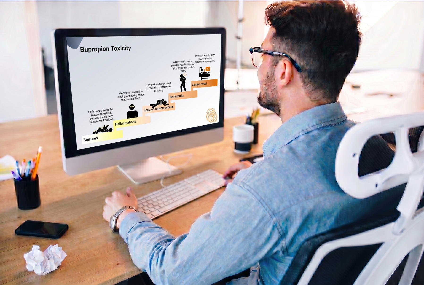 Person viewing a bupropion PowerPoint presentation featuring toxicity symptoms and overdose complications on a desktop computer.