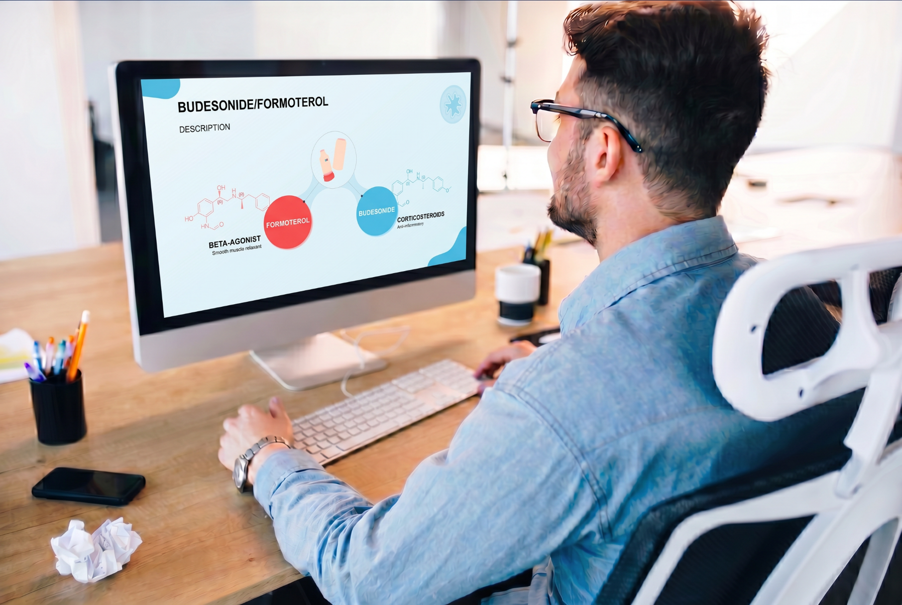 Person viewing a budesonide and formoterol PowerPoint presentation featuring the drug combination and therapeutic components.