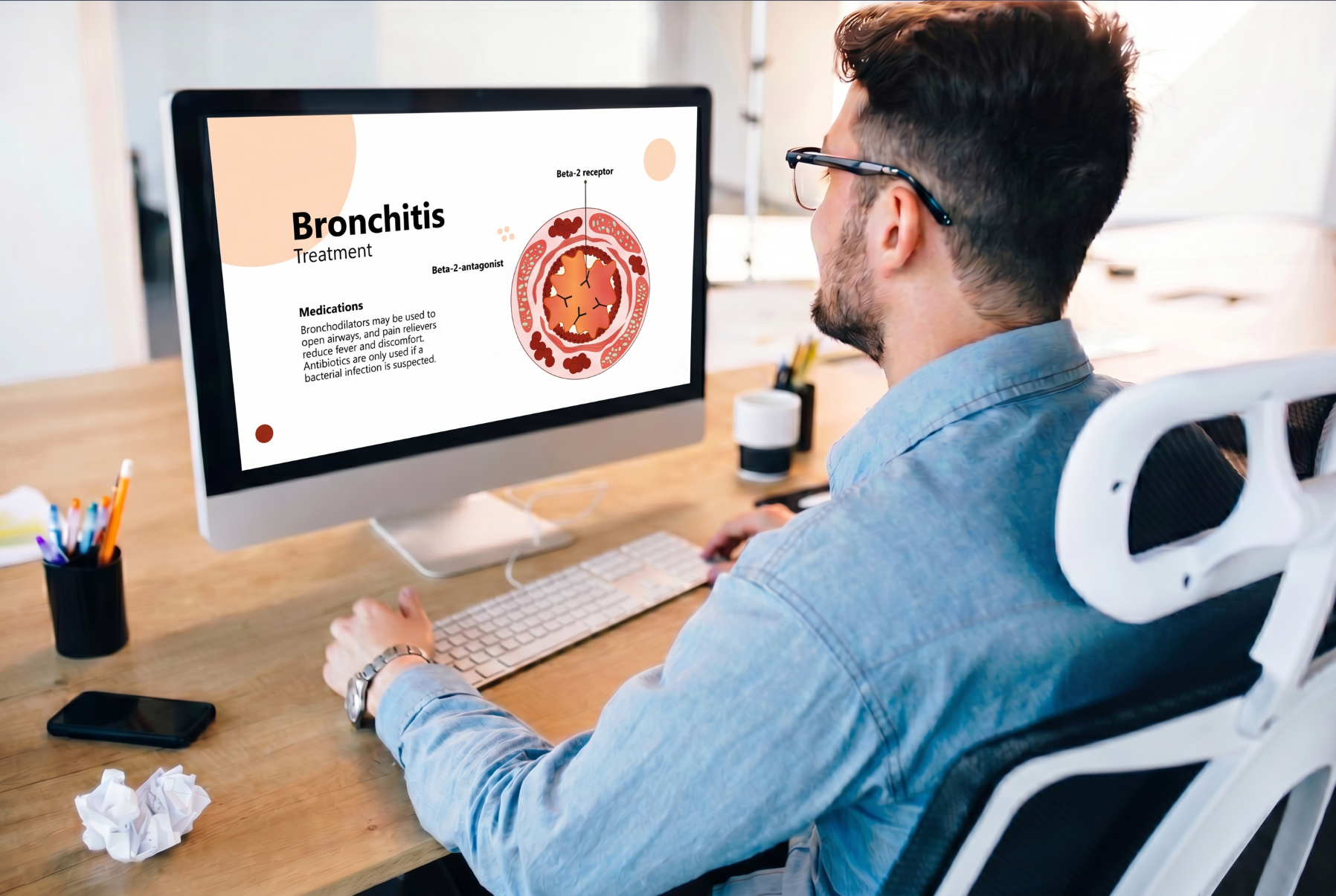 Person viewing a bronchitis treatment PowerPoint presentation on a desktop computer with a medical airway illustration.