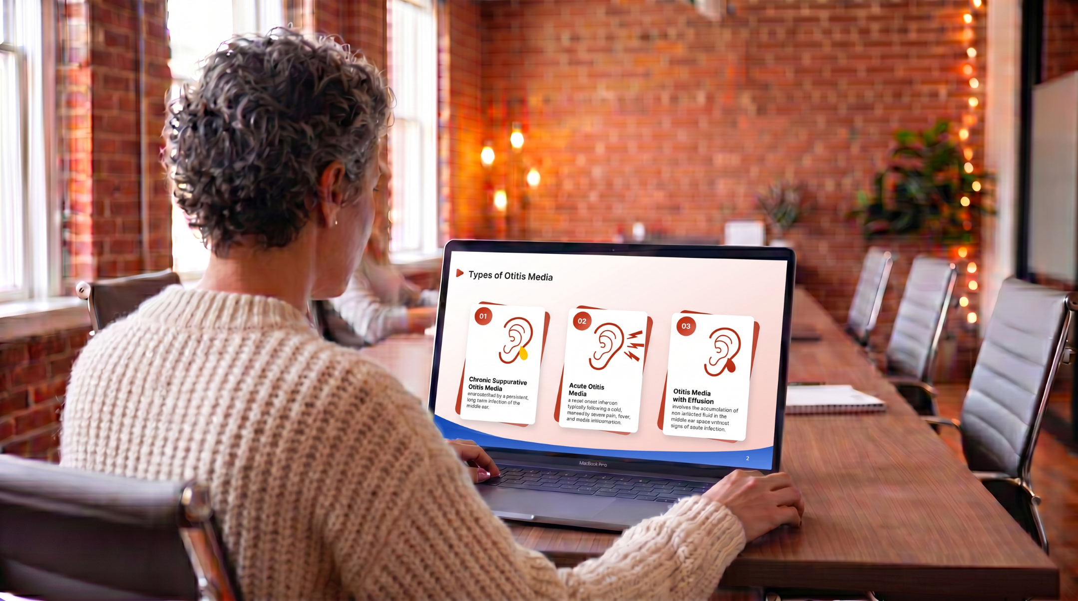 Medical learner reviewing different types of otitis media using an editable Otitis Media PowerPoint Template on a laptop.