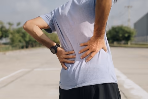 Muscle or ligament strains can cause a stiff back.
