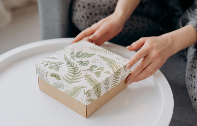 A hand holding a box