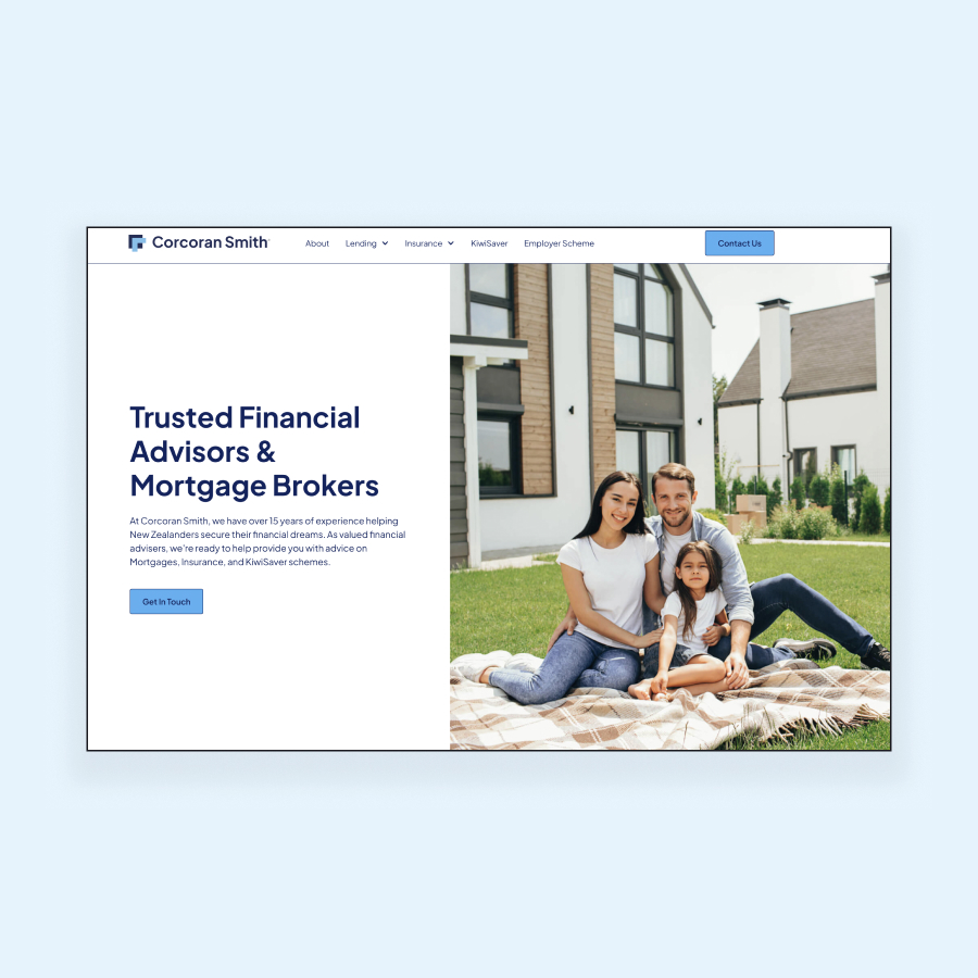 Family sitting on blanket in front of modern house, financial advisors website