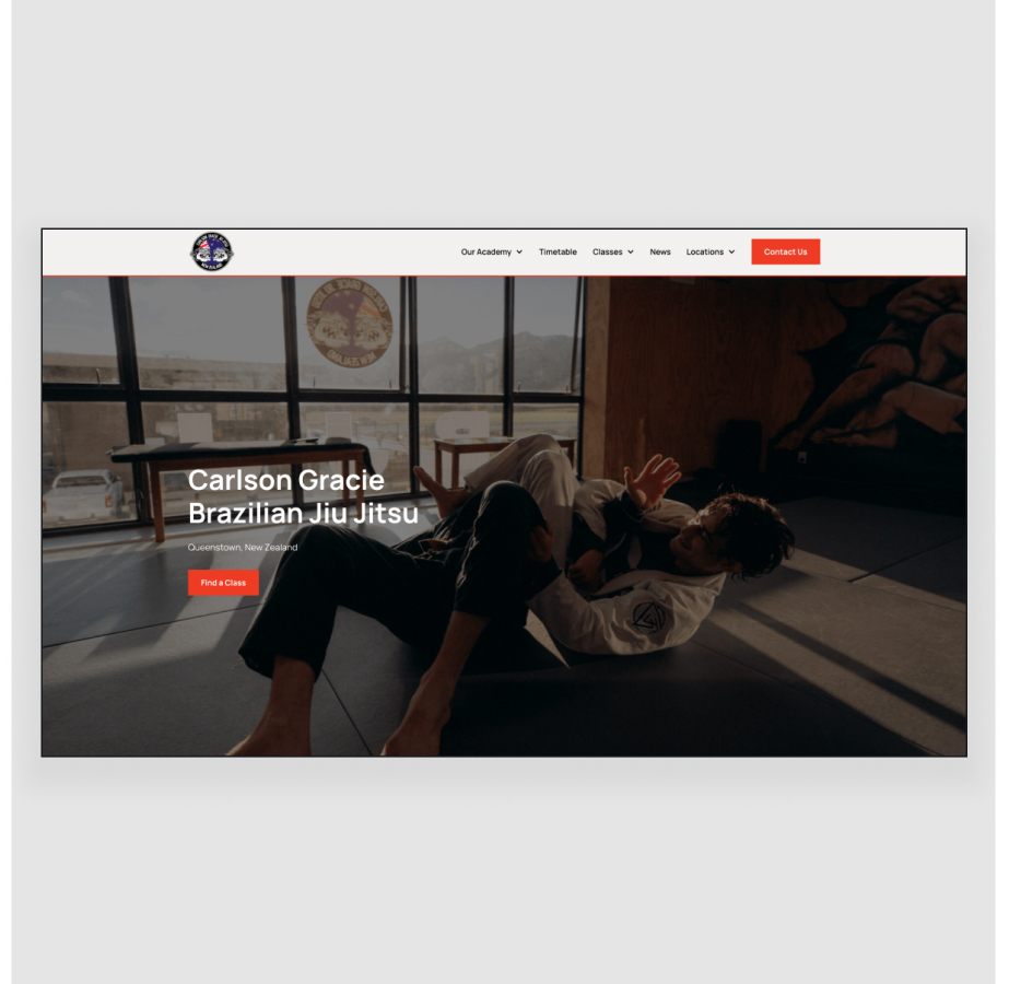 Brazilian Jiu-Jitsu practitioners grappling on mat in training studio