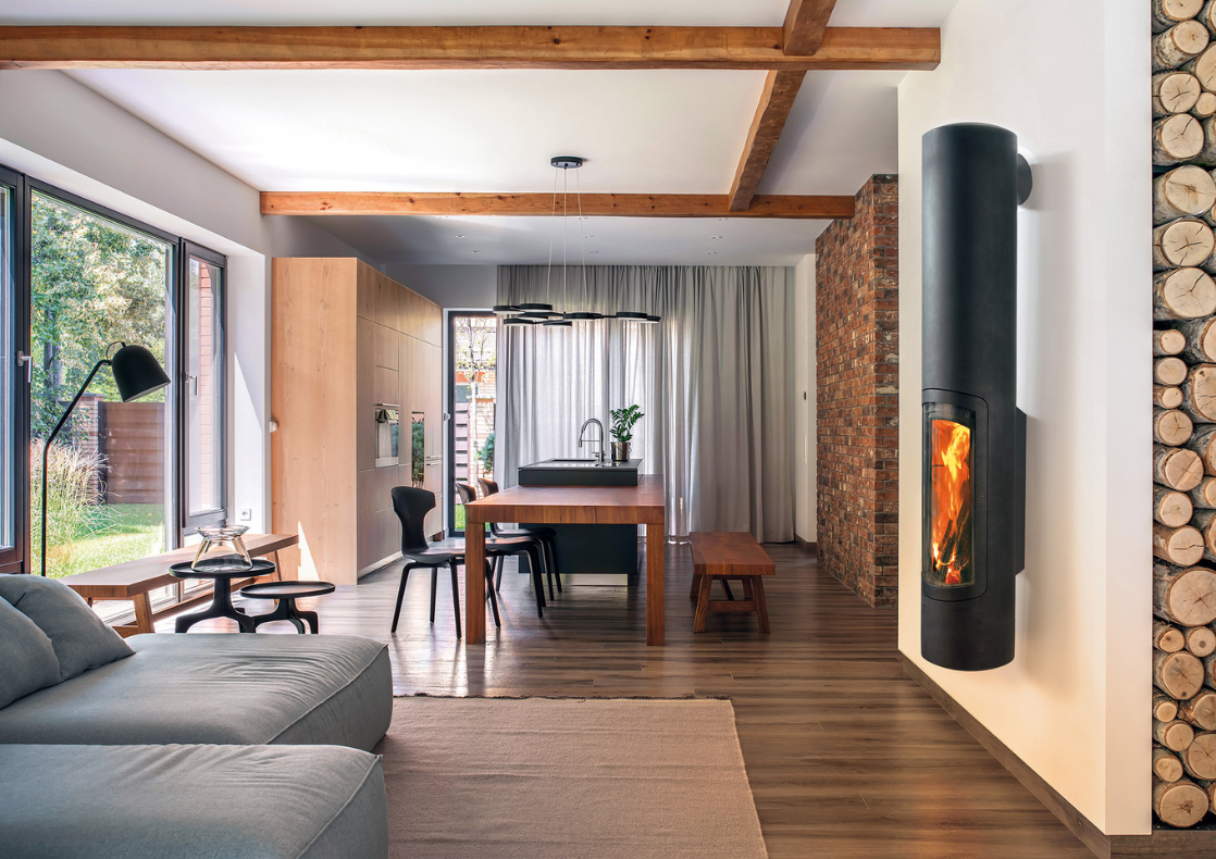 Focus fireplaces Grappus wall-mounted wood-burner in cosy mountain lodge living room