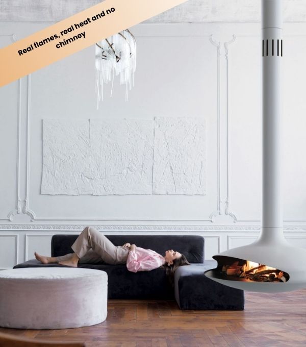 Suspended Gyrofocus white bioethanol fireplace next to a black sofa