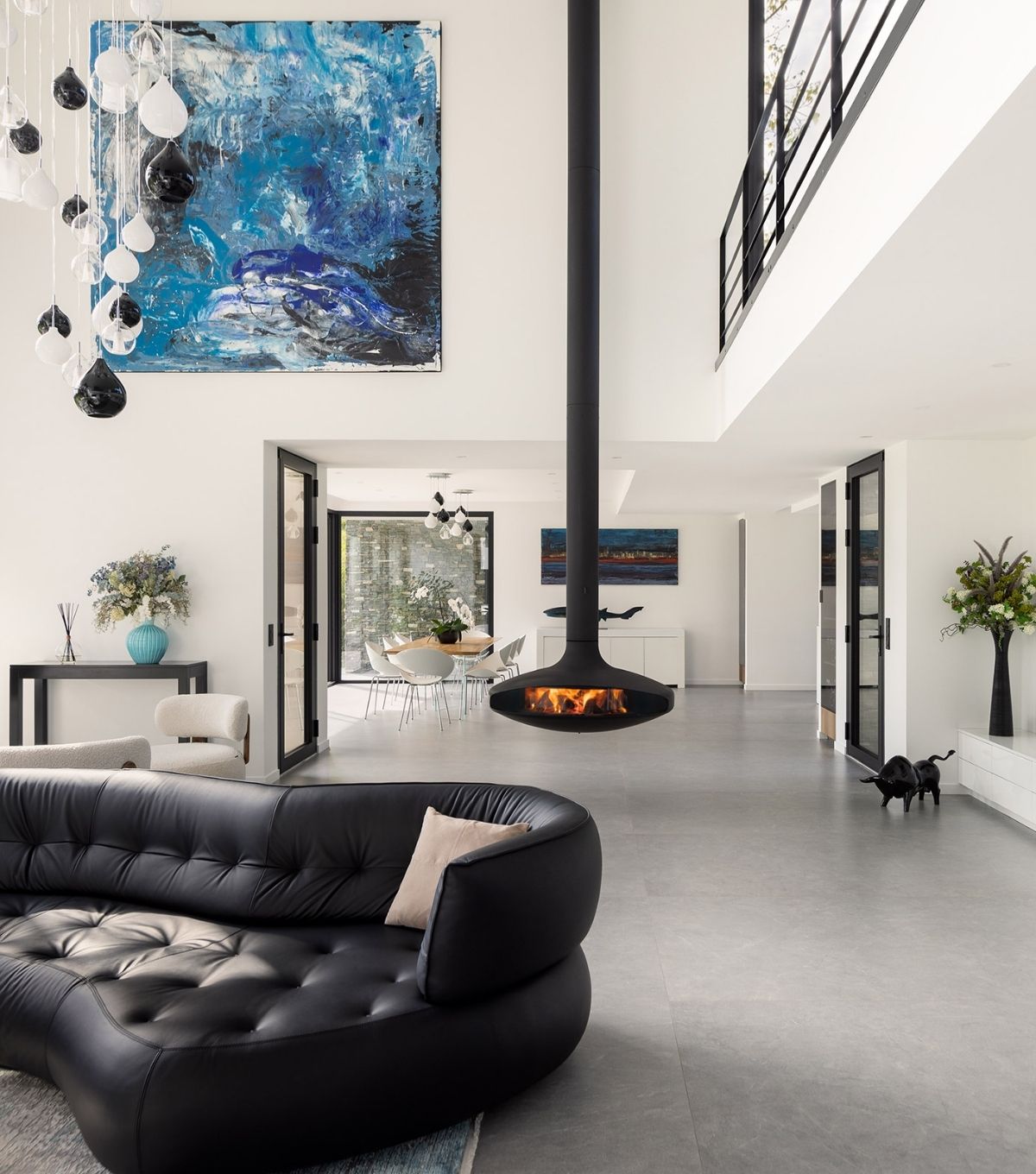 High ceiling home with suspended Gyrofocus woodburner