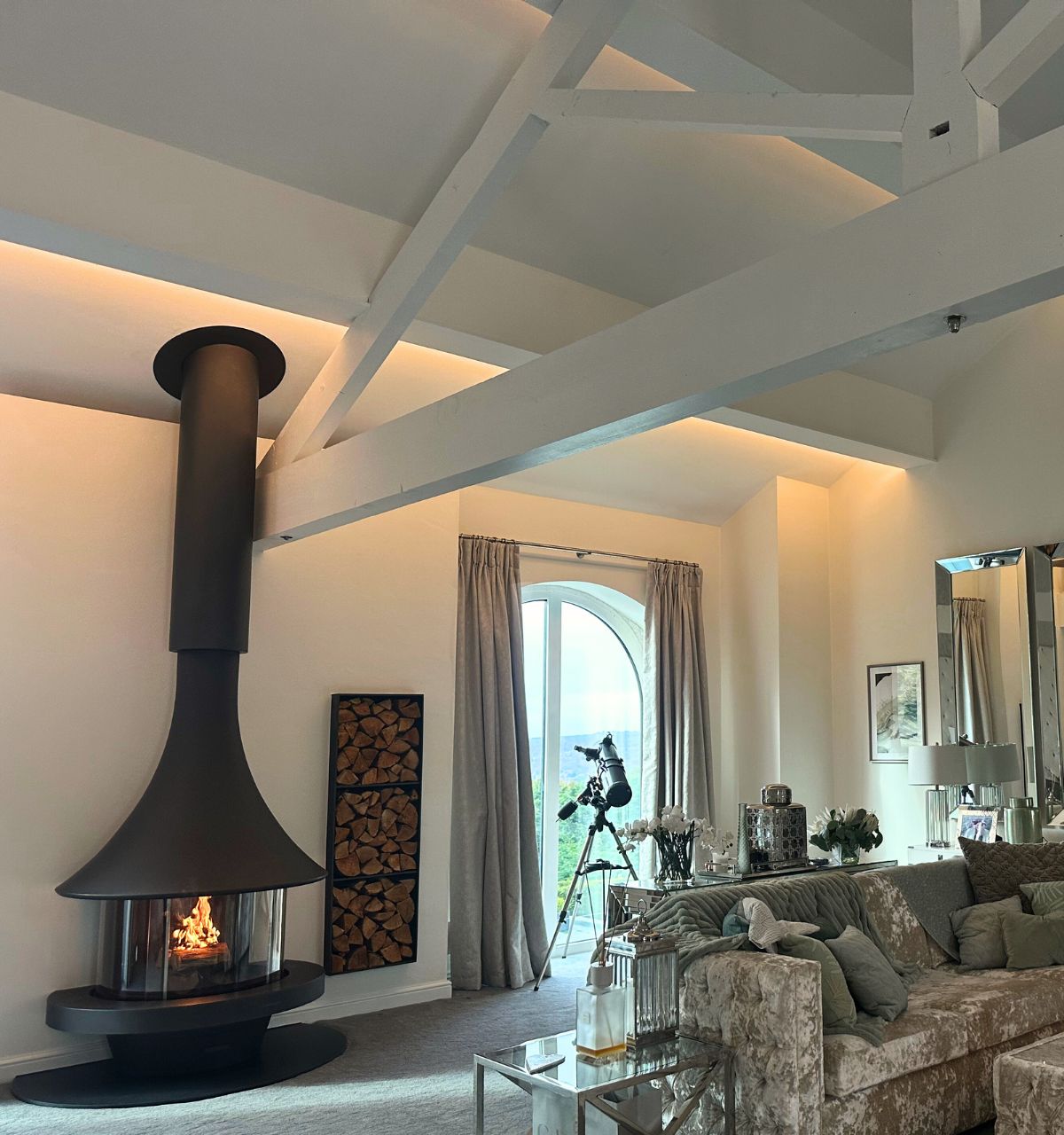 a wall-mounted woodburning JC Bordelet EVA in a modern bedroom