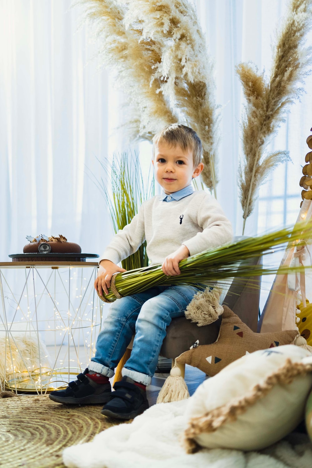 A child celebrating beside a chocolate birthday cake at Dukley