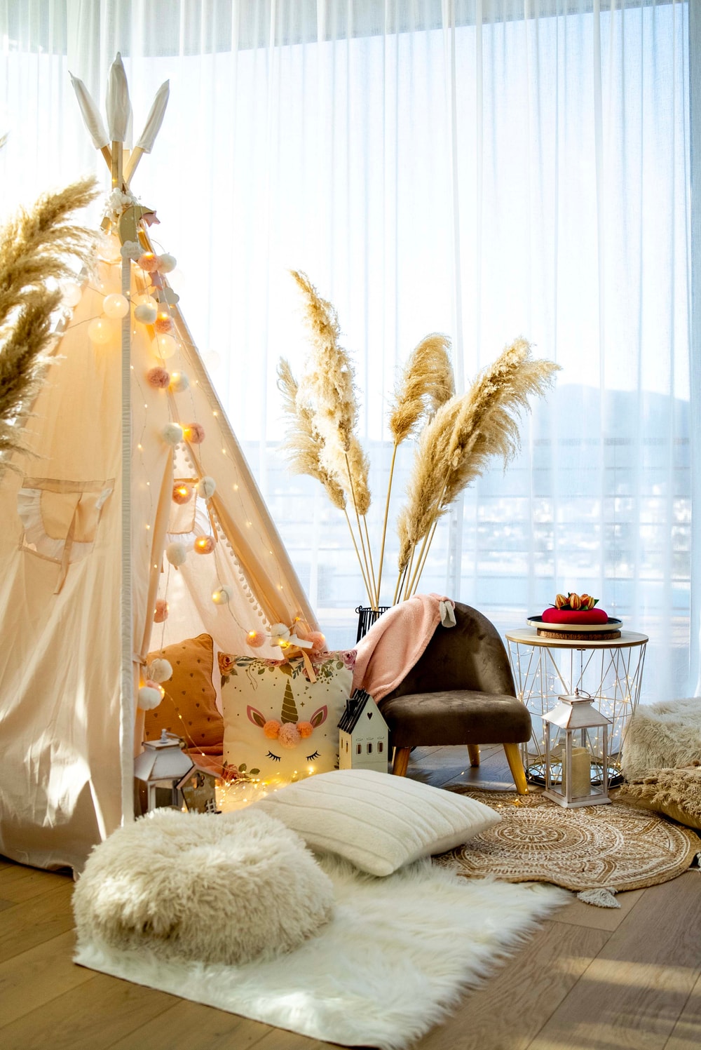 Dukley party photo zone with a decorated teepee, cushions and fairy lights