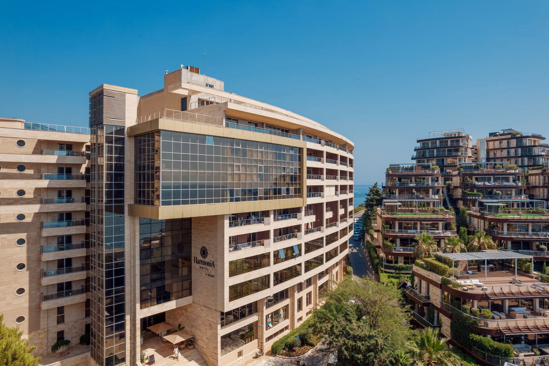 Hotel Harmonia facade and surrounding residences in Budva