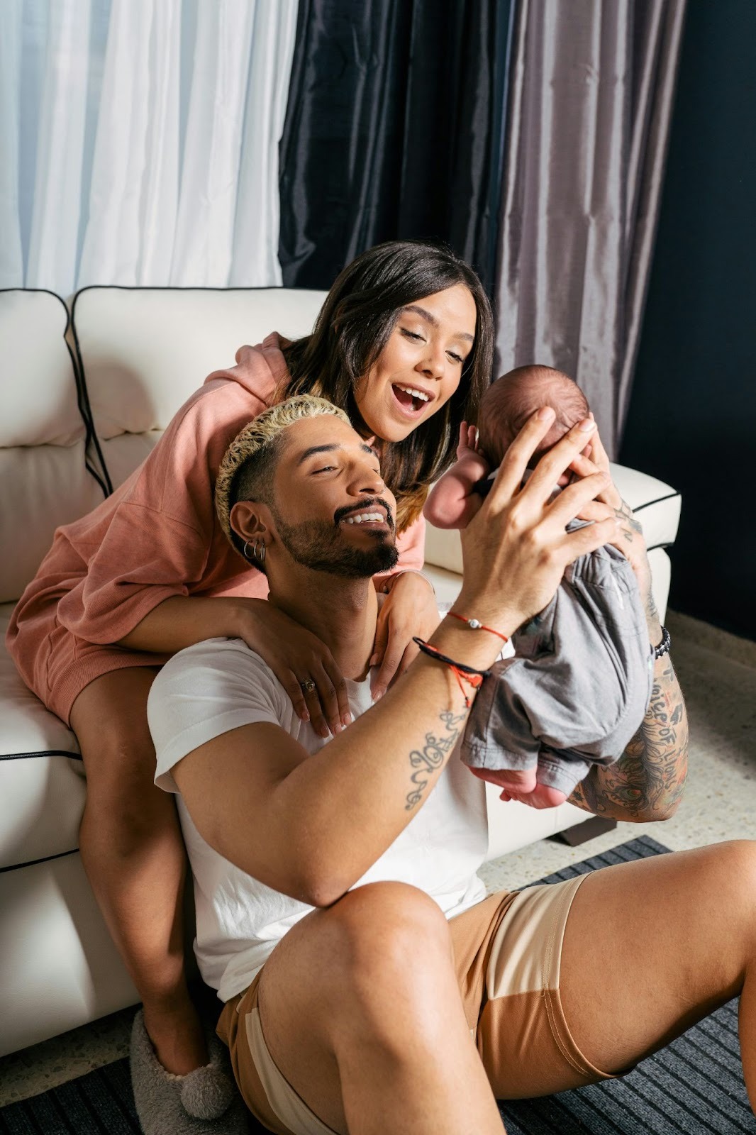 Parents of a newborn feeling connected after receiving couples counseling in Chicago and practical support for new parents from Pure Health Center. 