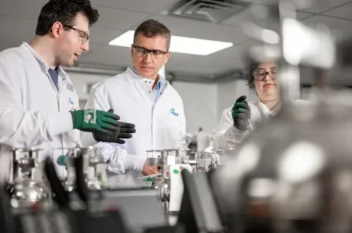 Scientists having discussion in laboratory