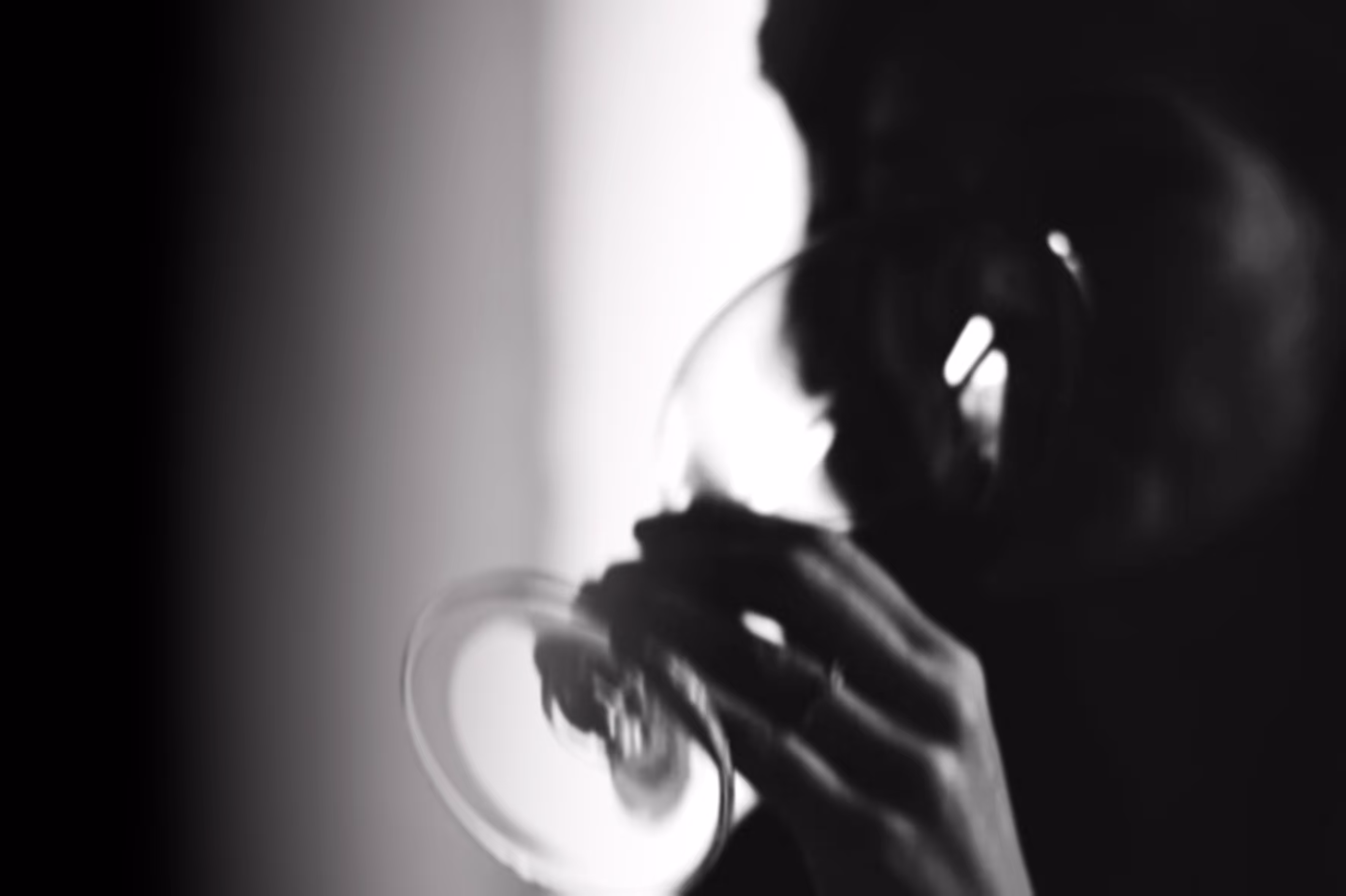 Beautiful lady drinking a glass of wine in a winebar in Kufstein.