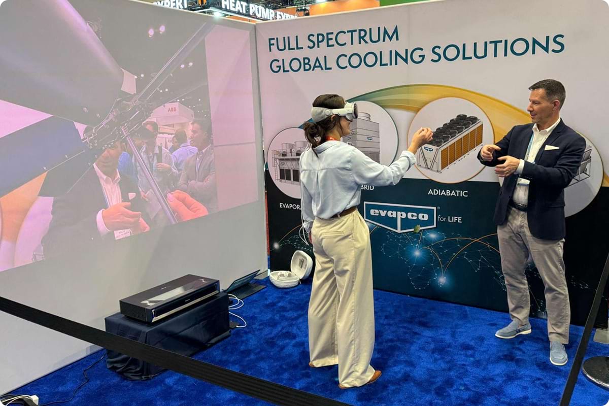 A HVAC trade show attendee views Evapco Jigs on Apple Vision Pro