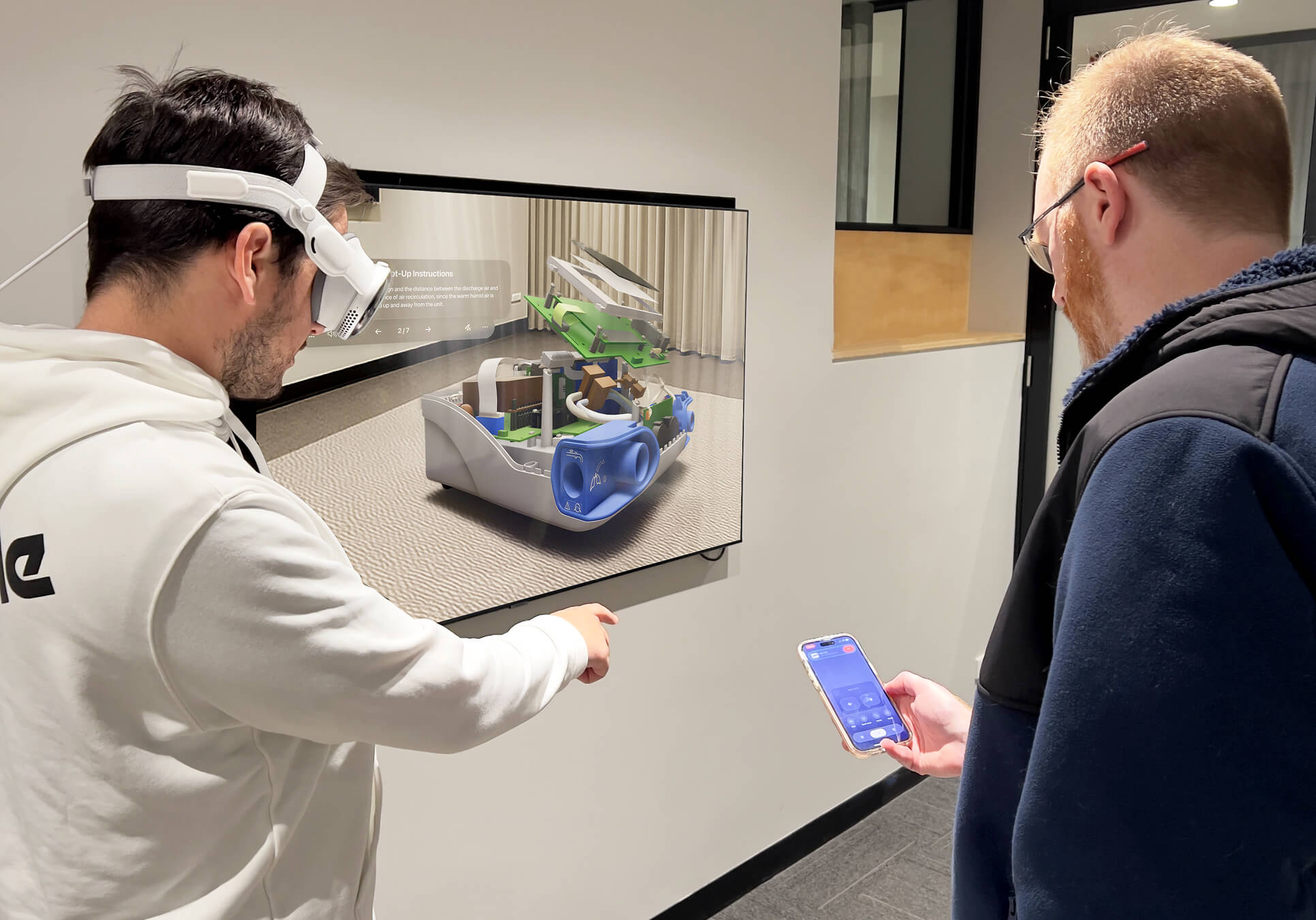 Guest wearing Vision Pro looking at medical device controlled by JigSpace AVP Remote Control app